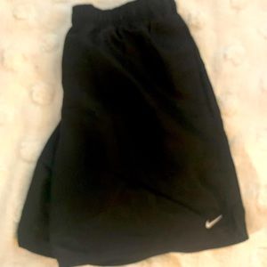 NWOT men’s large Nike swim trunks.  7” inseam.  Mesh brief.  Side pockets.